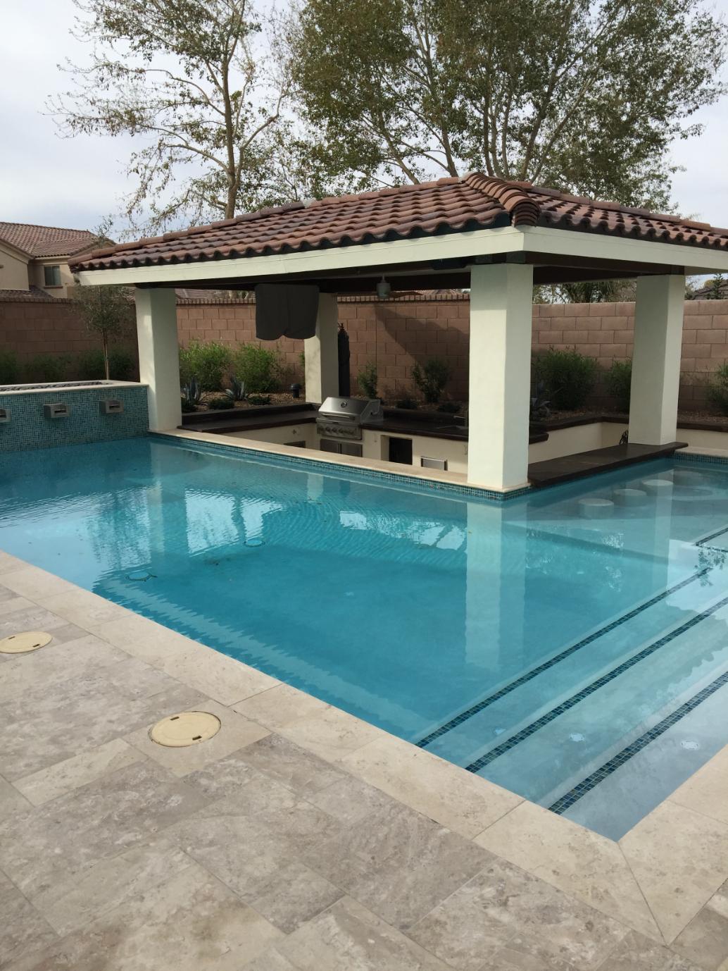 Stone patio with built-in fire pit and seating area